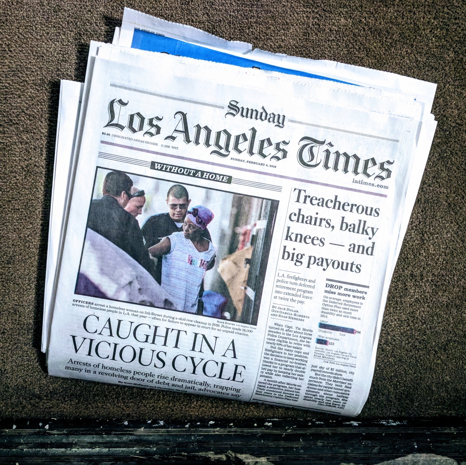 Sunday edition of the Los Angeles Times lying on a doorstep, with two Data Desk investigations above the fold.