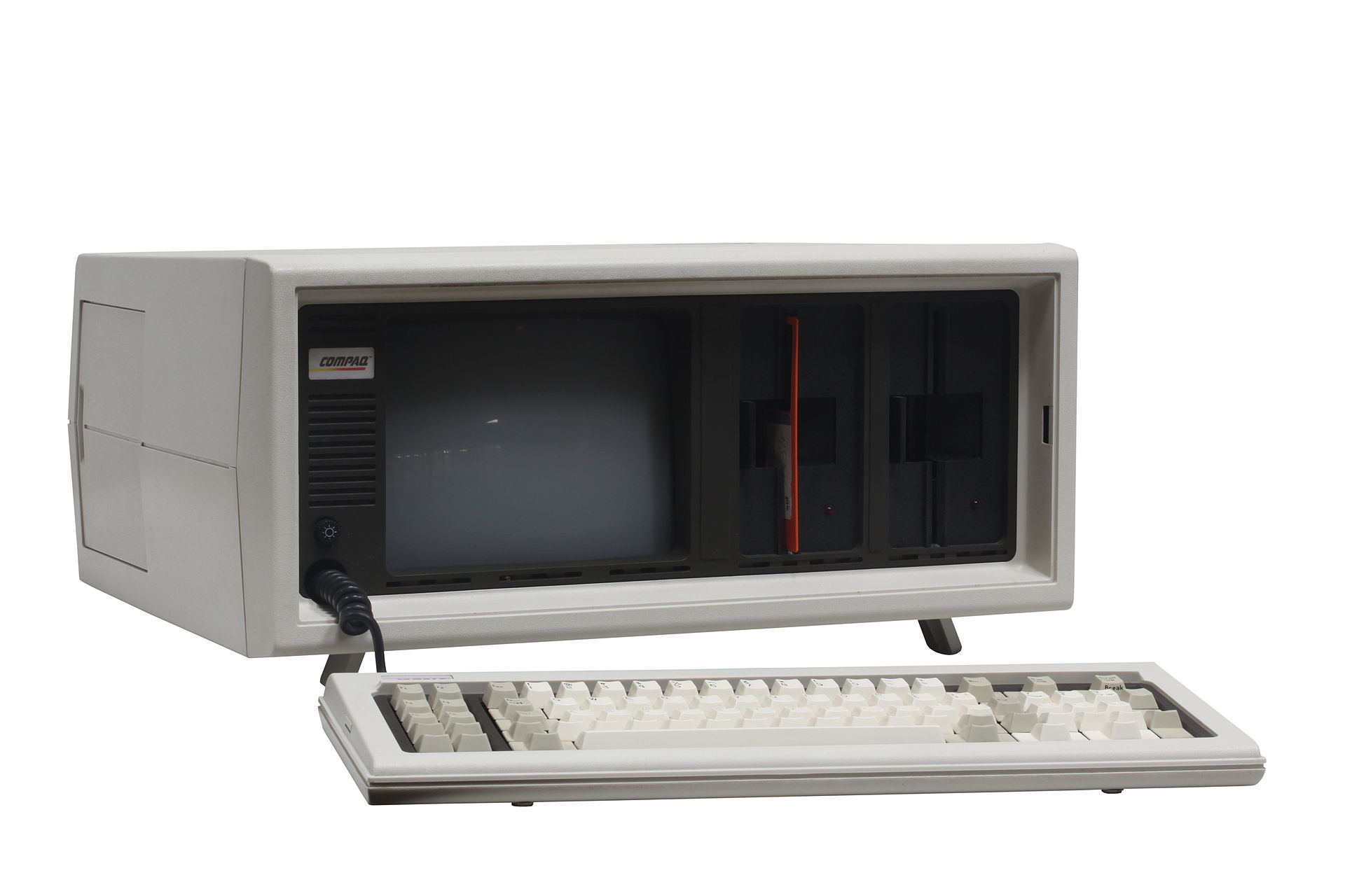 A Compaq Portable personal computer with its keyboard detached.